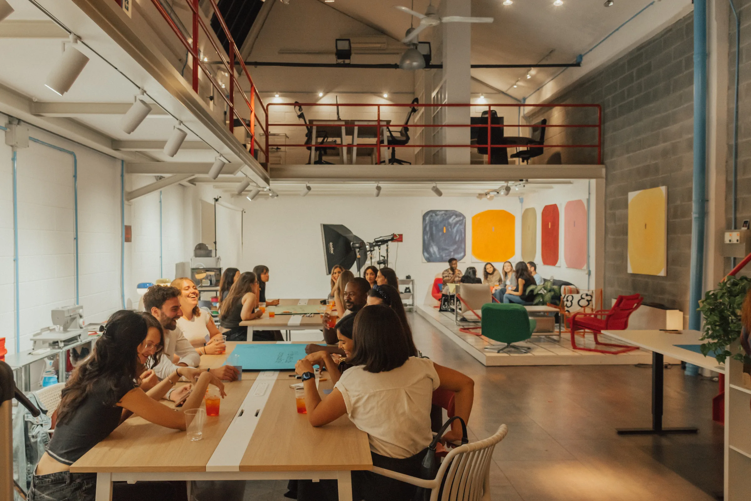 Creatives meeting and working together around the tables at Spazio ivy
