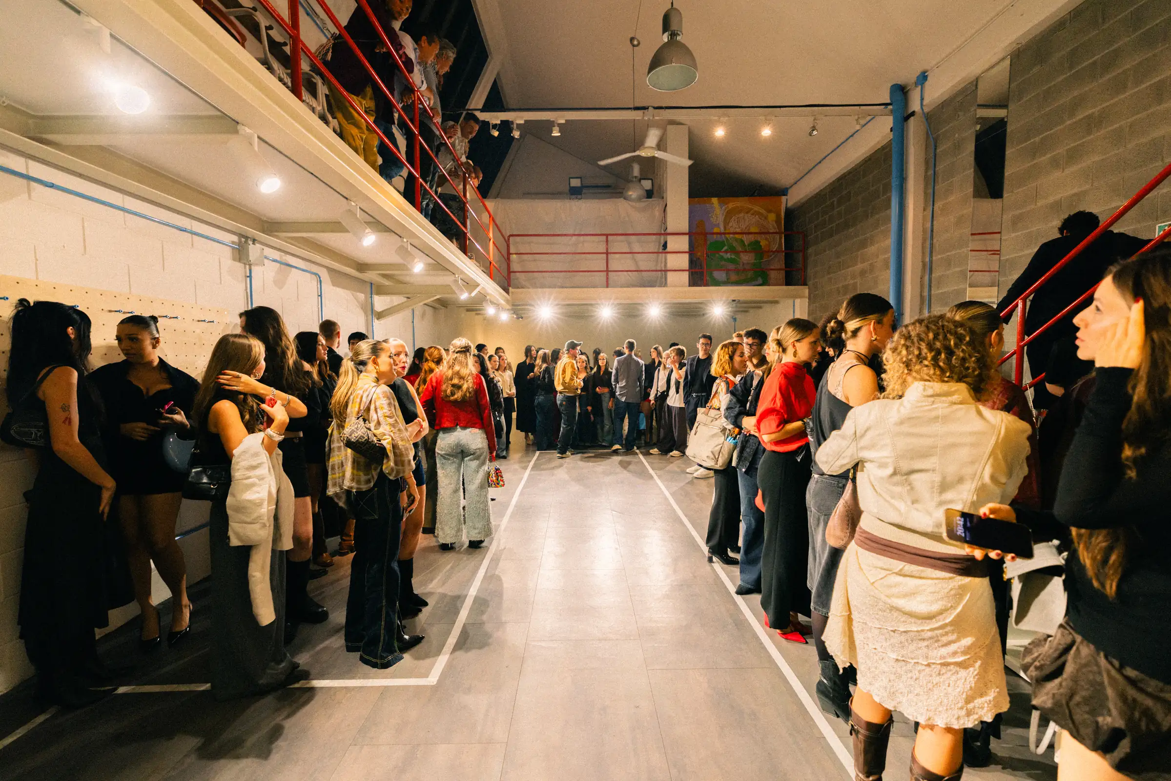 A crowd of guests at an event inside Spazio ivy during Milano Fashion Week